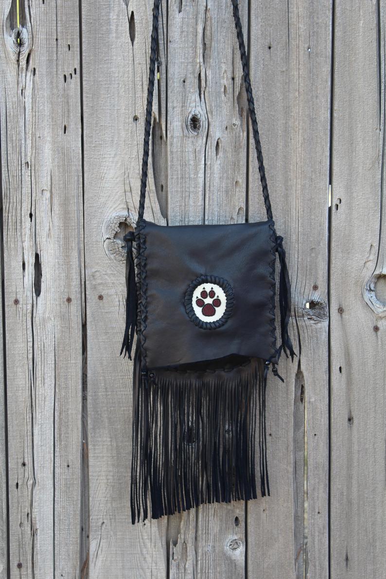 Black fringed handbag, beaded wolf paw design