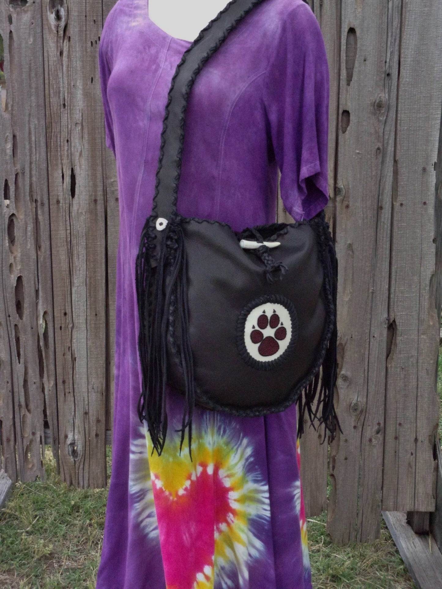 Black leather tote with wolf paw totem