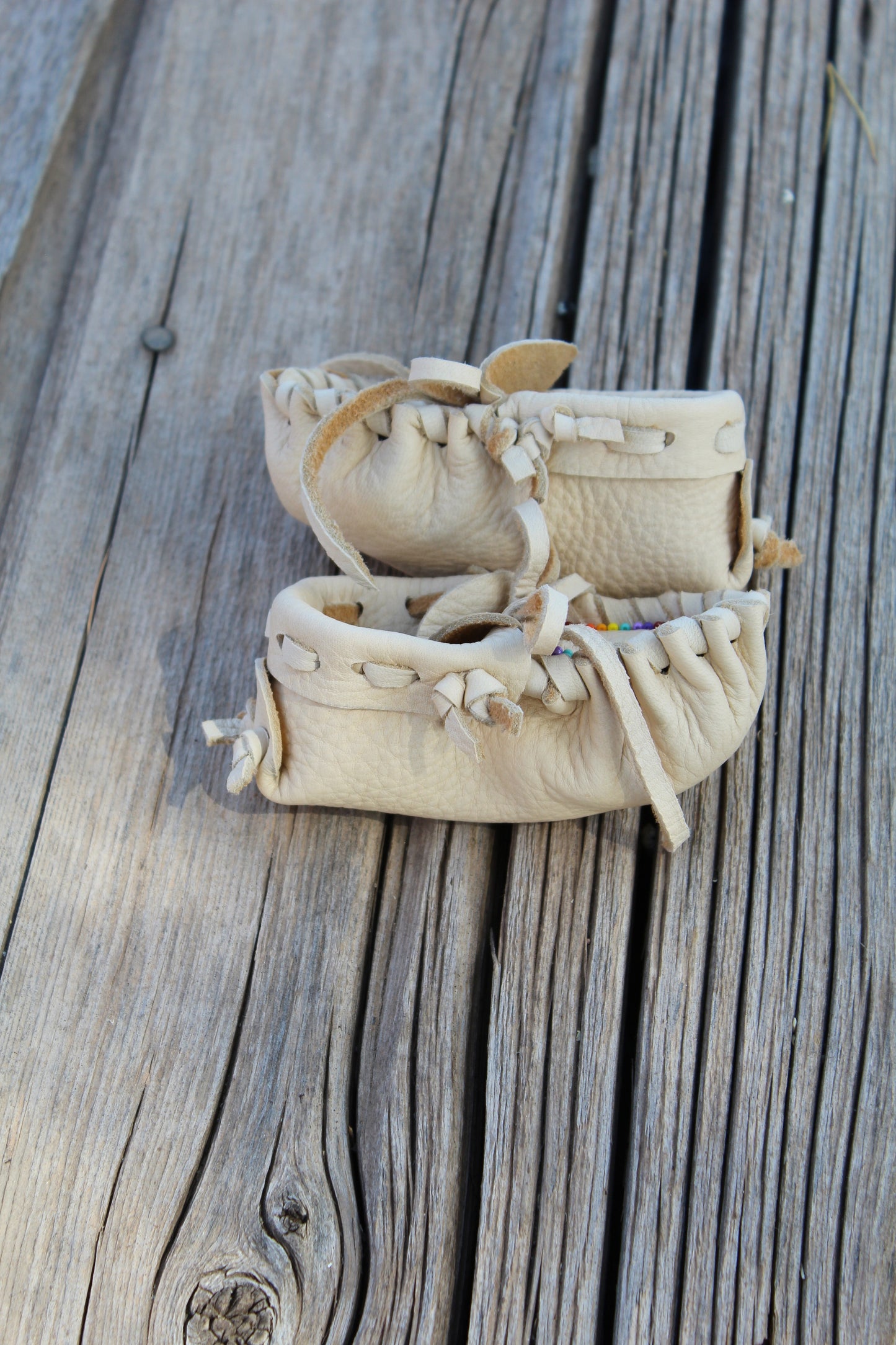Beaded baby moccasin set with medicine bag