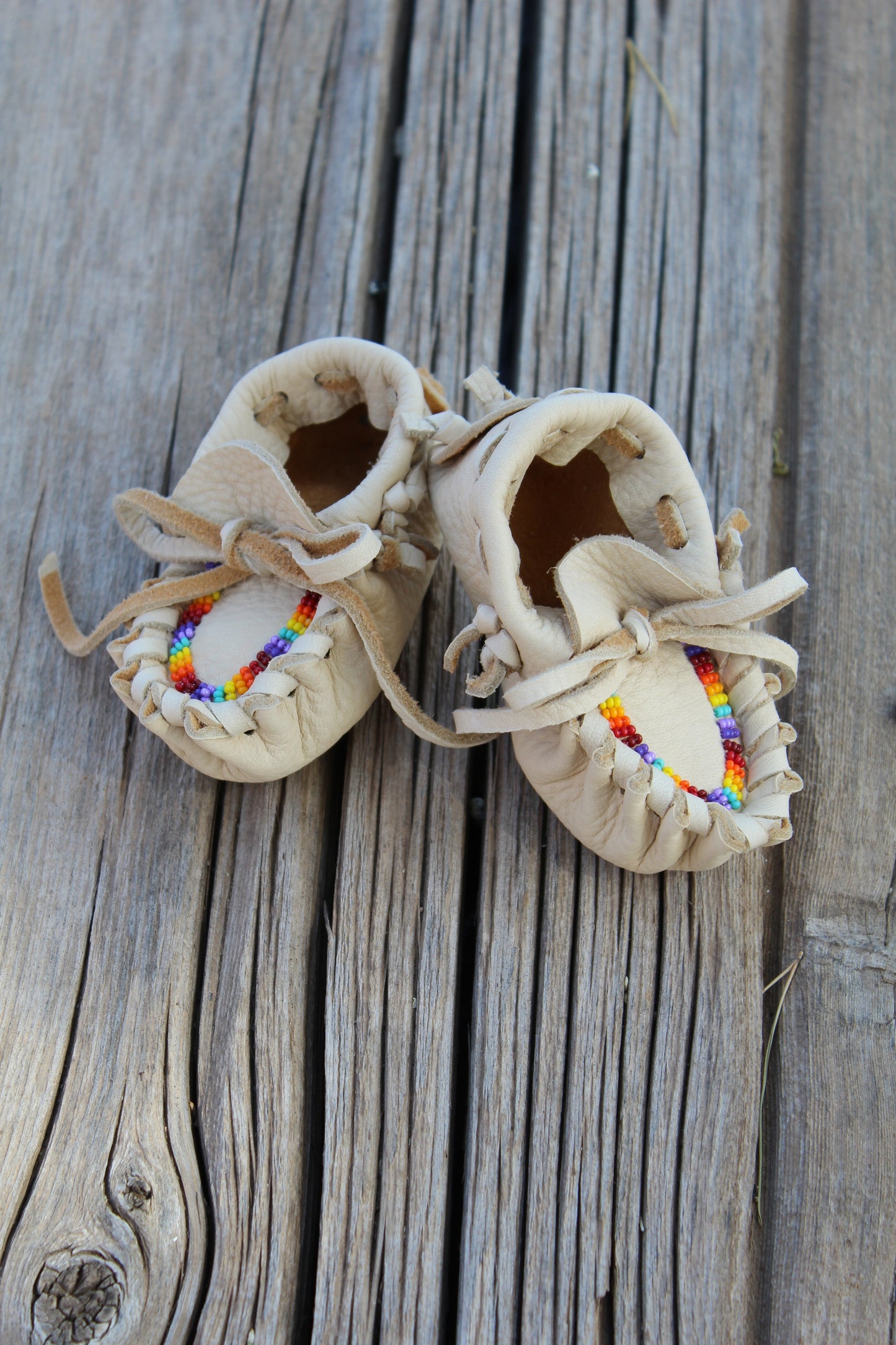 Beaded baby moccasin set with medicine bag