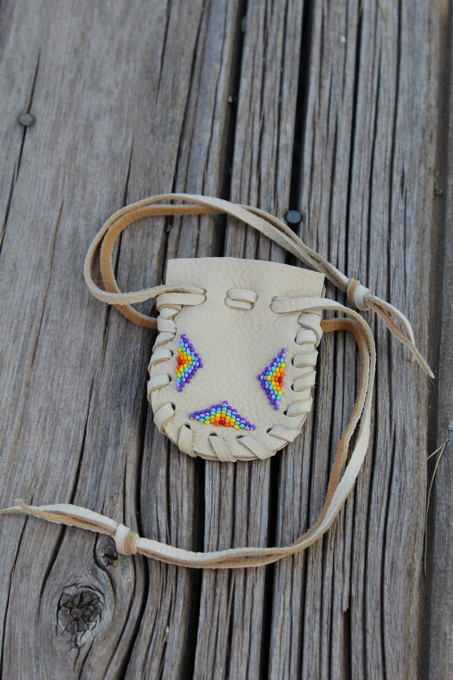 Beaded baby moccasin set with medicine bag