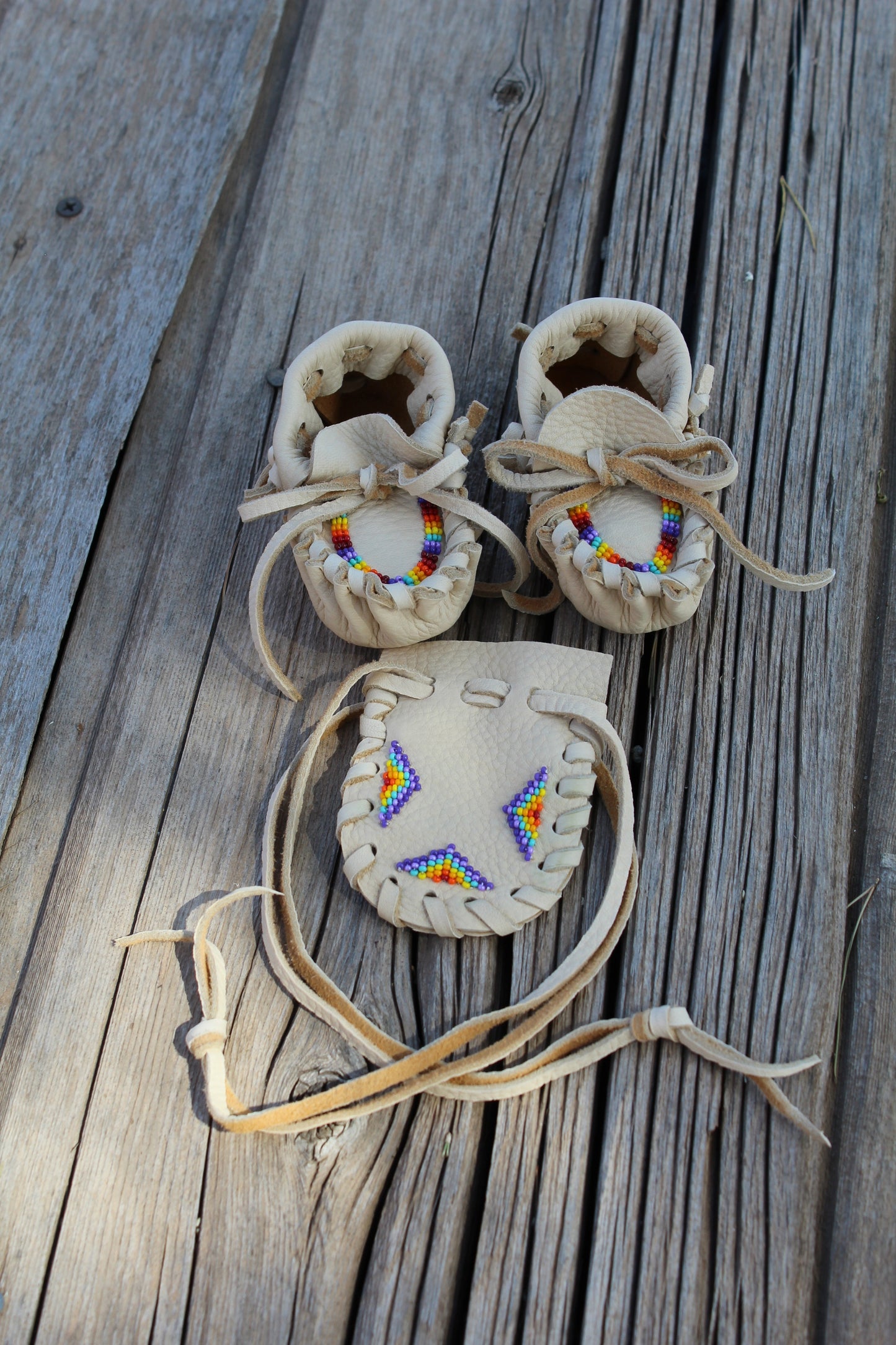 Beaded baby moccasin set with medicine bag