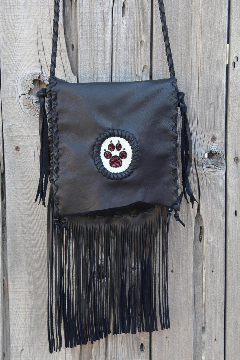 Black fringed handbag, beaded wolf paw design