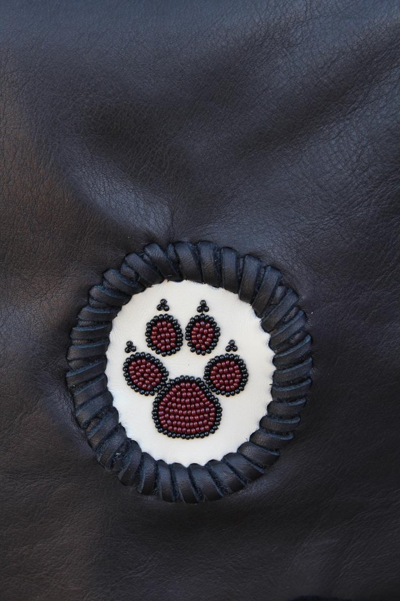 Black fringed handbag, beaded wolf paw design