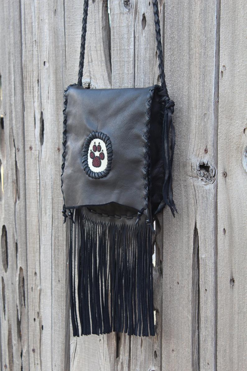 Black fringed handbag, beaded wolf paw design