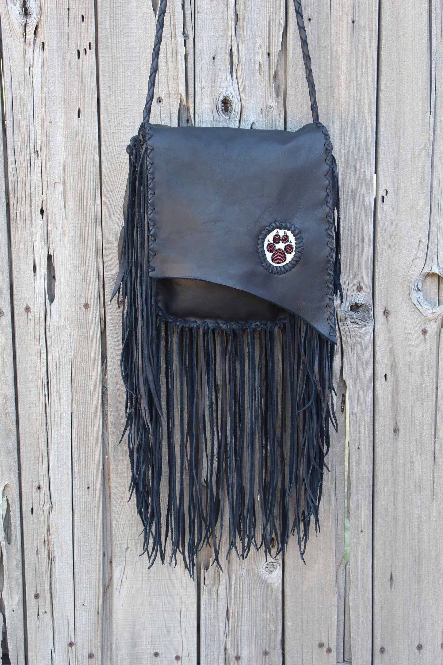 Fringed black handbag, beaded wolf paw handbag