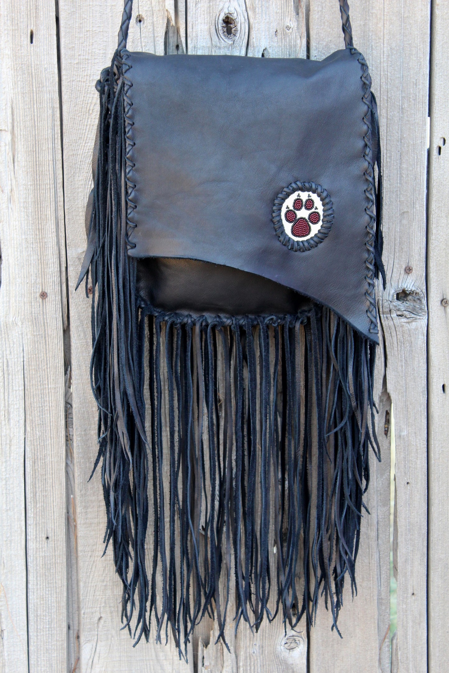 Fringed black handbag, beaded wolf paw handbag