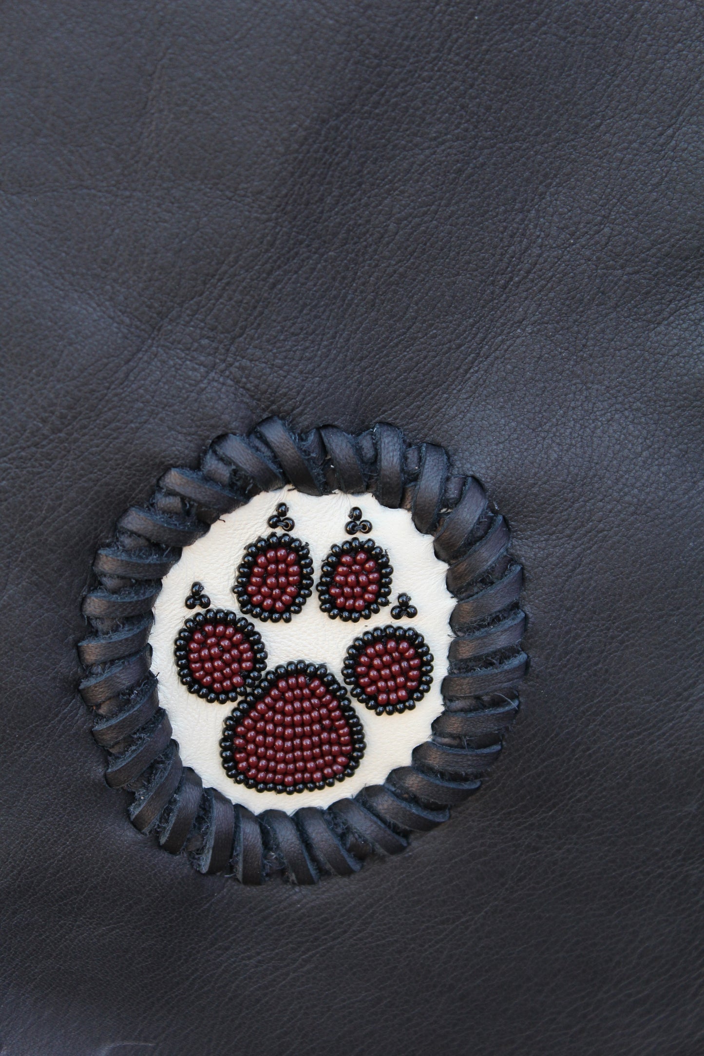 Fringed black handbag, beaded wolf paw handbag