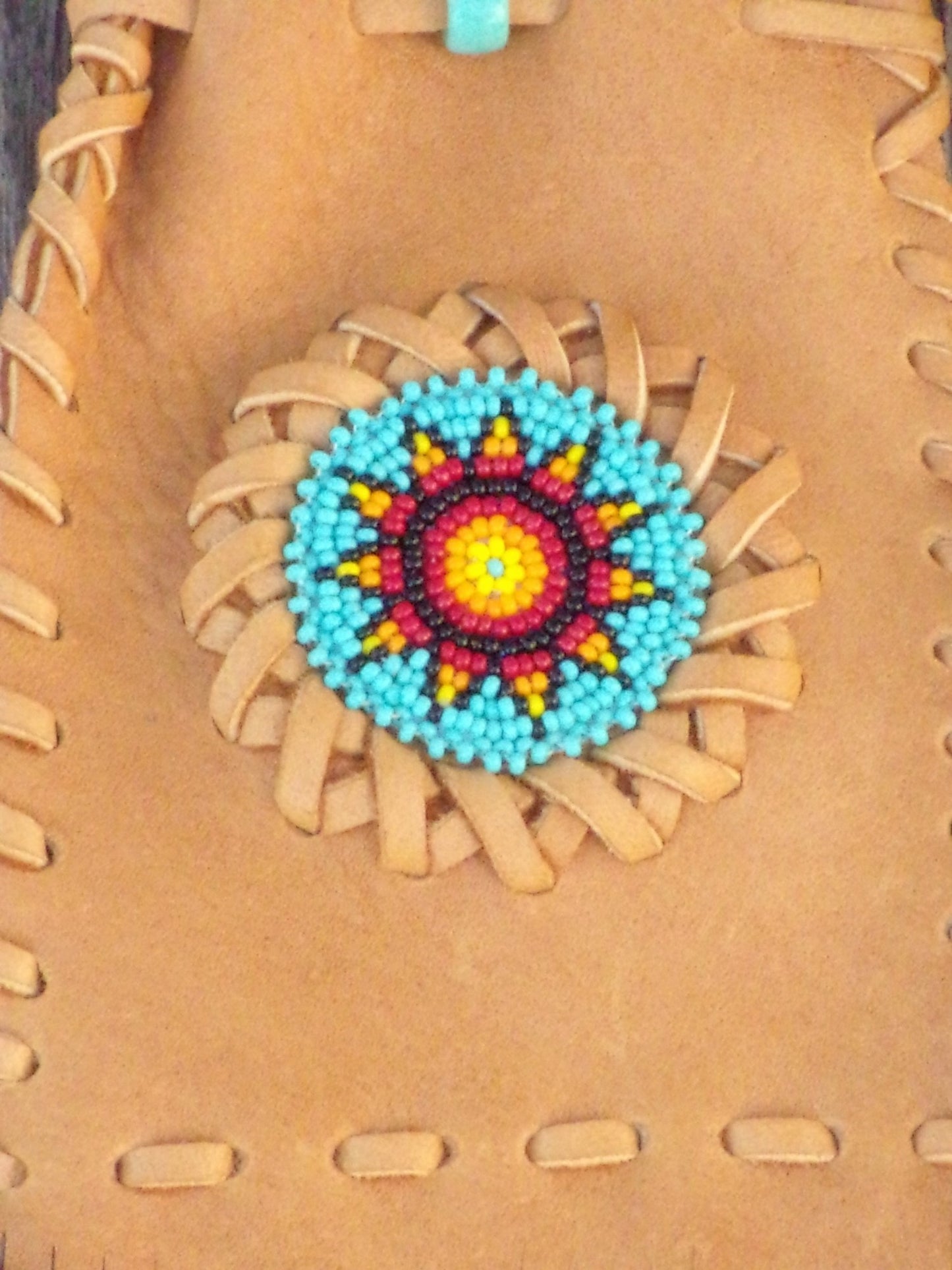 Fringed leather amulet bag, sunflower beadwork