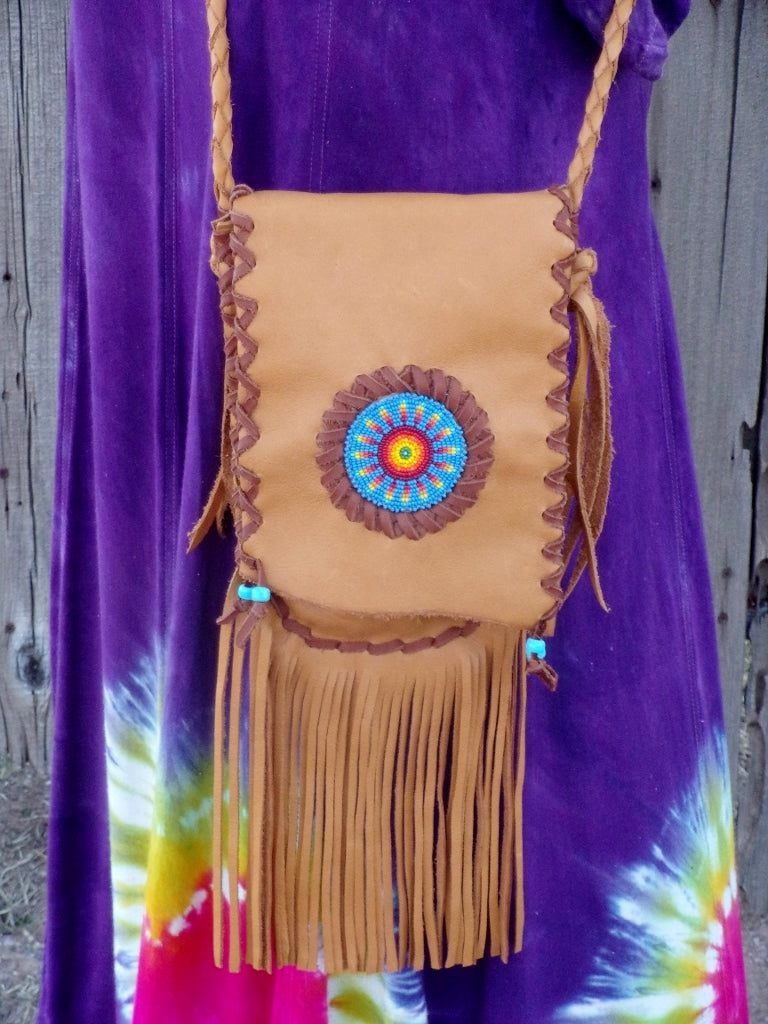 Fringed leather handbag with a beaded starburst rosette design , custom designed