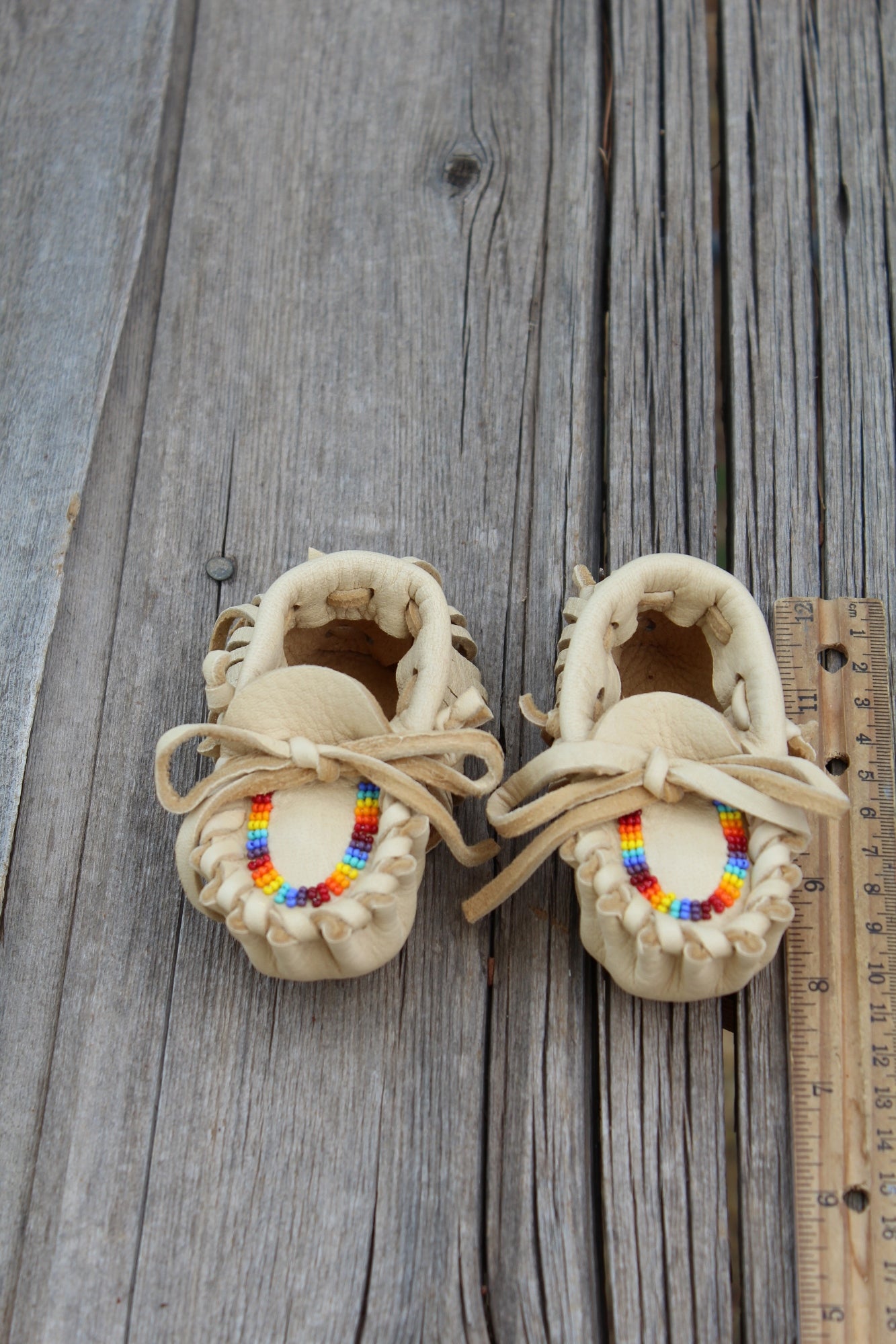 Beaded baby moccasins, fringed moccasins