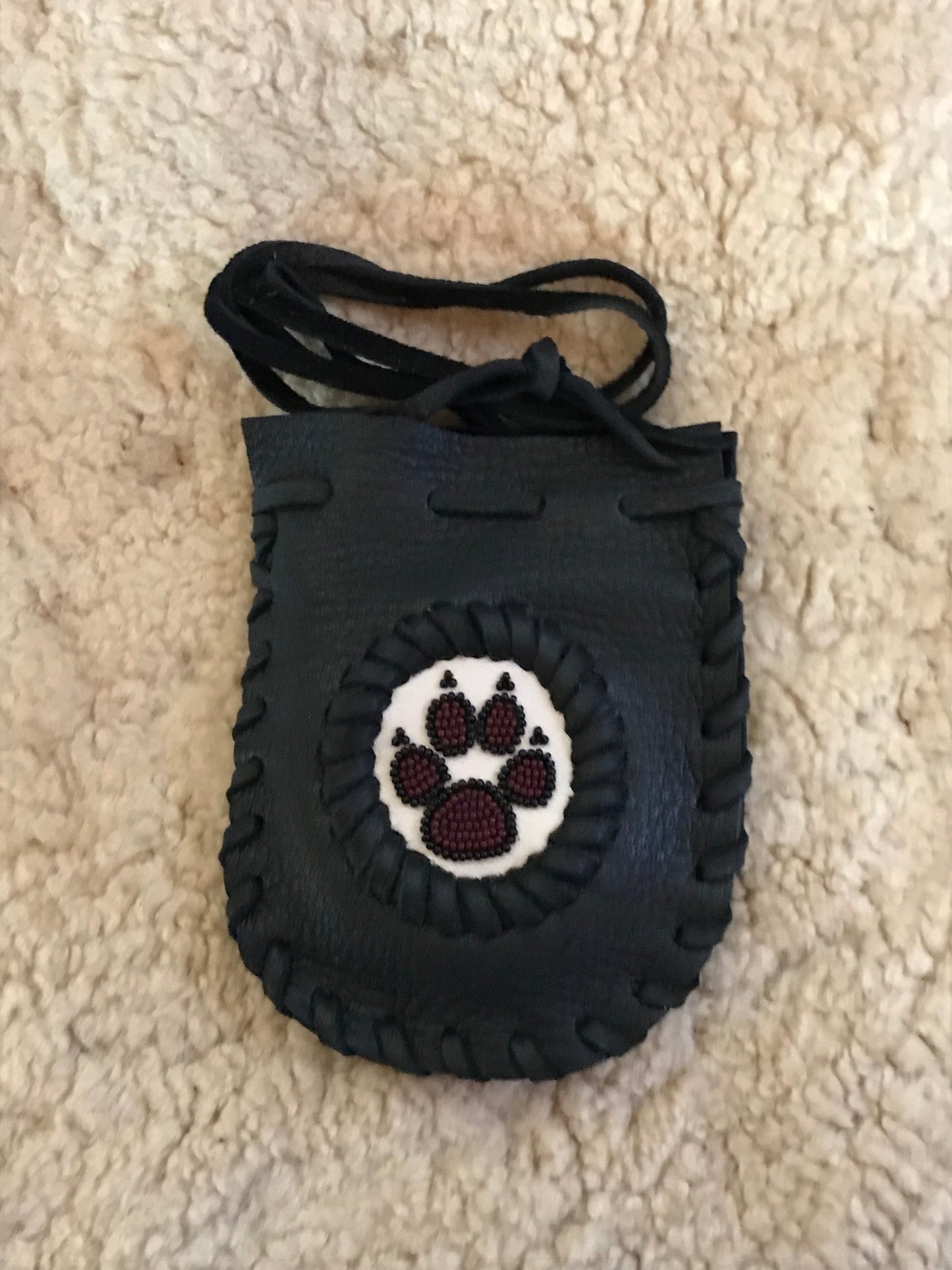 Black beaded wolf paw bag, beaded medicine bag