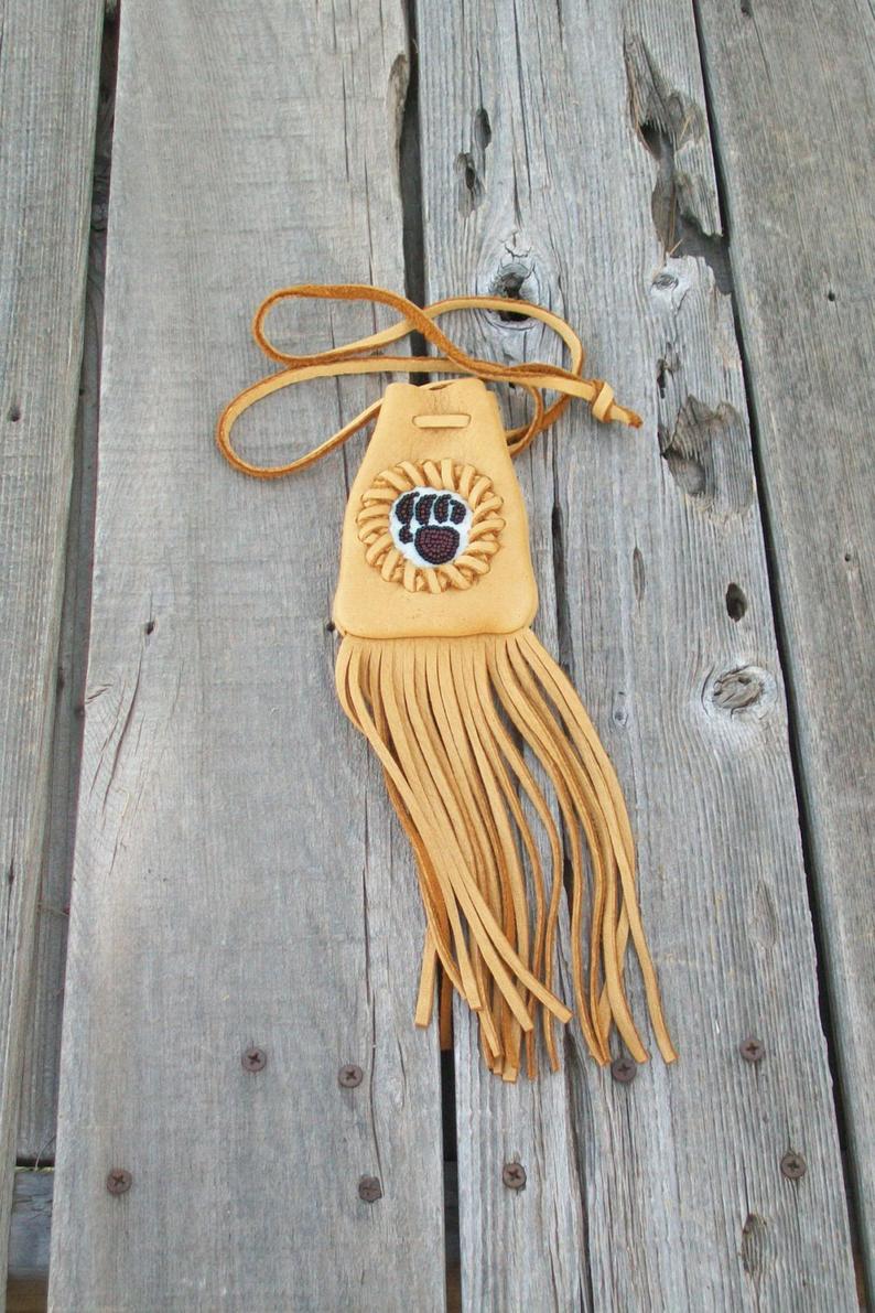 Fringed medicine bag with bear paw totem, leather neck pouch