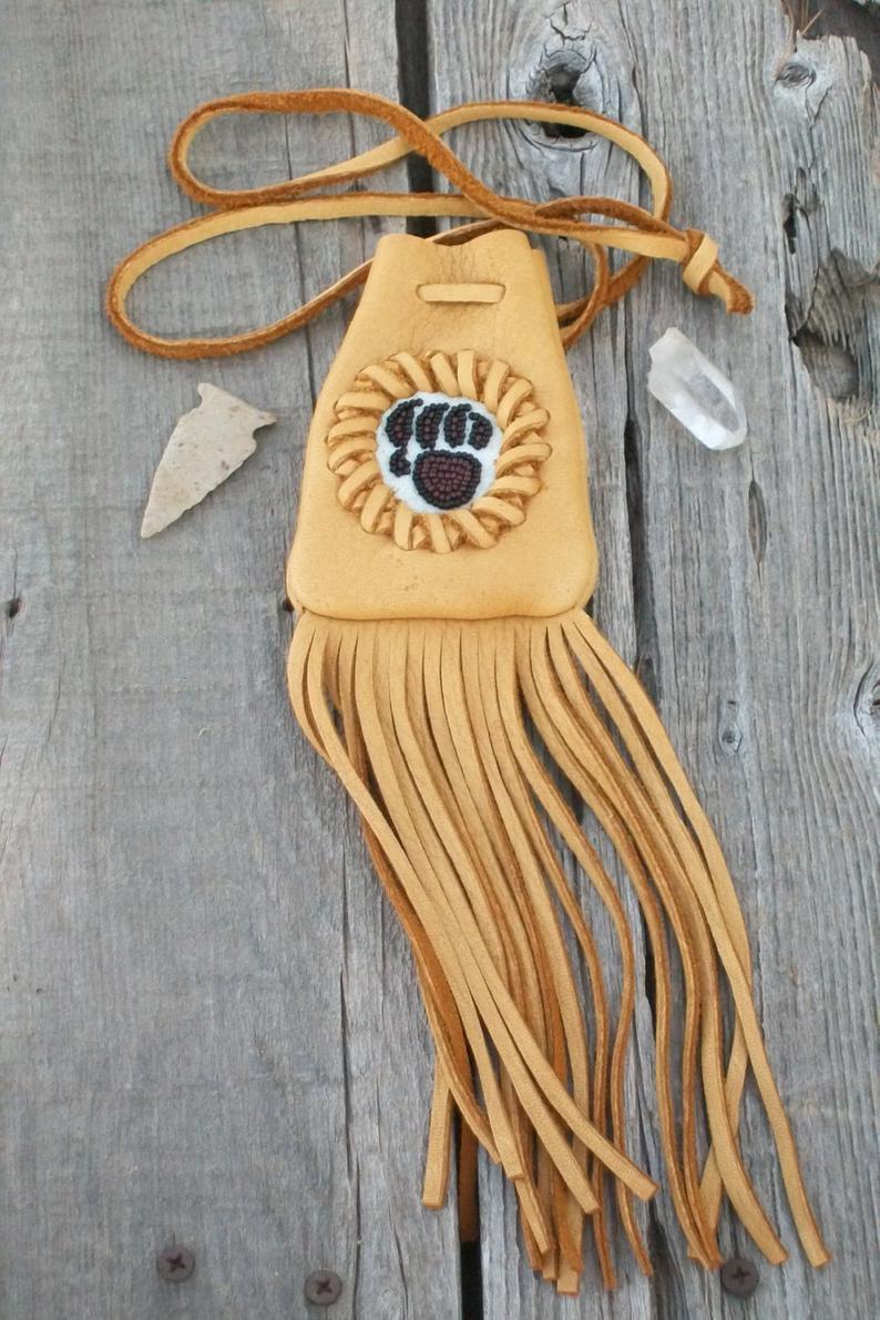 Fringed medicine bag with bear paw totem, leather neck pouch