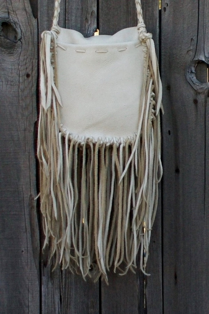 Fringed leather handbag with bear paw totem, totem handbag