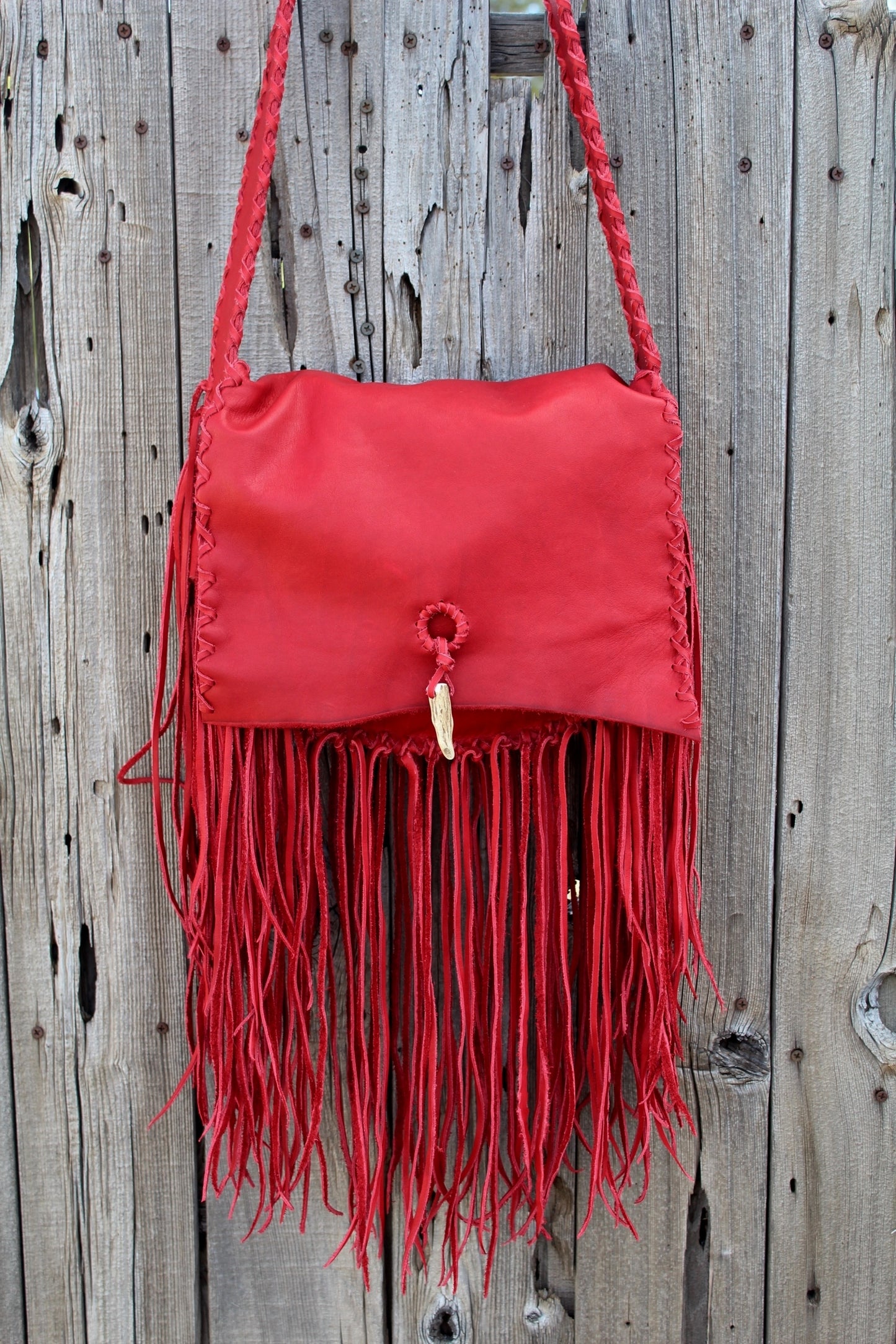 Fringed red leather handbag, soft leather bag