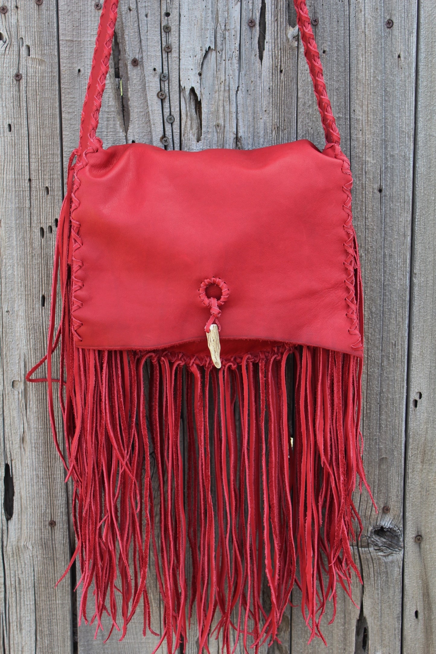 Fringed red leather handbag, soft leather bag