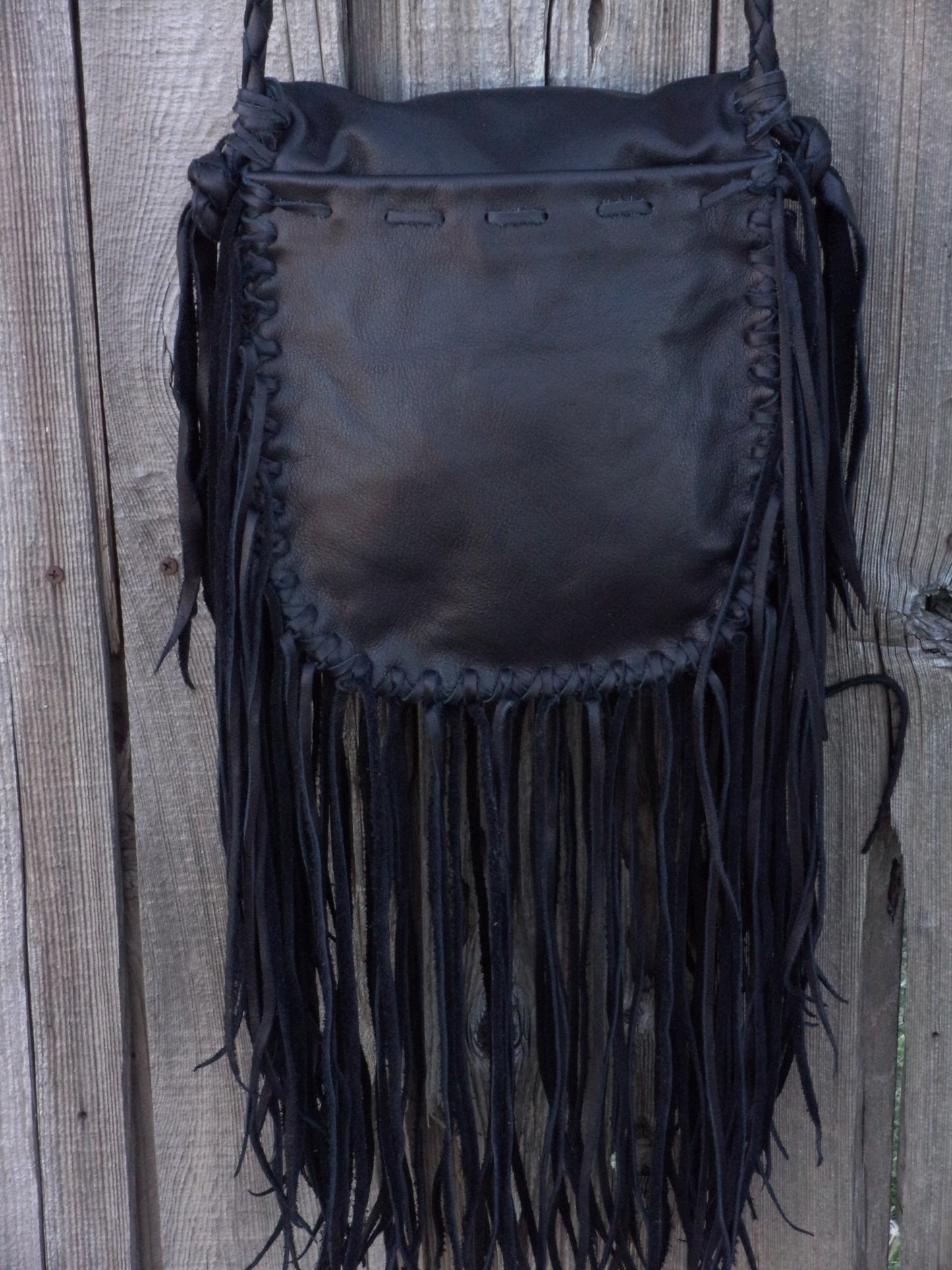 Black leather fringed handbag, bohemian style