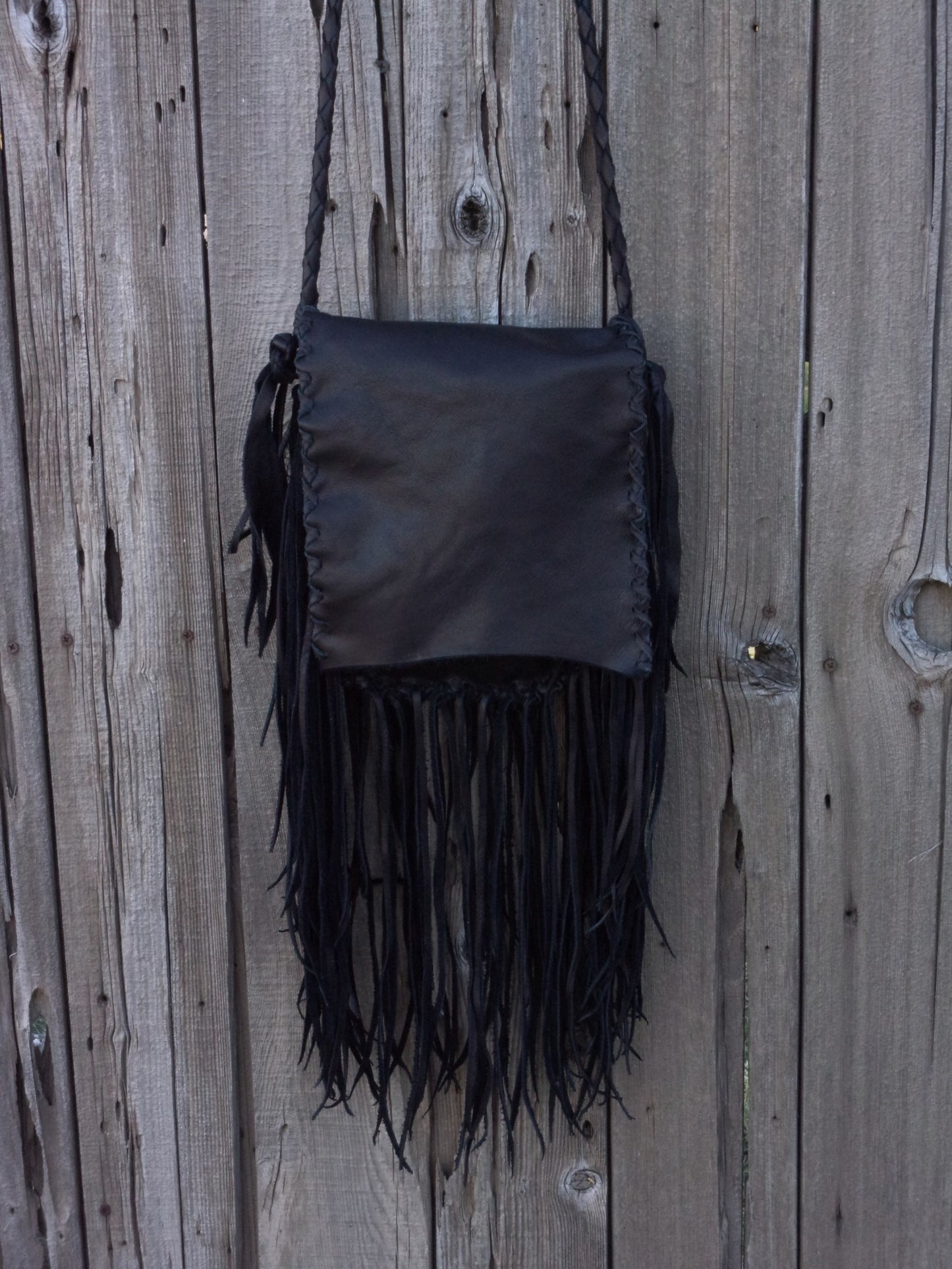 Black leather fringed handbag, bohemian style