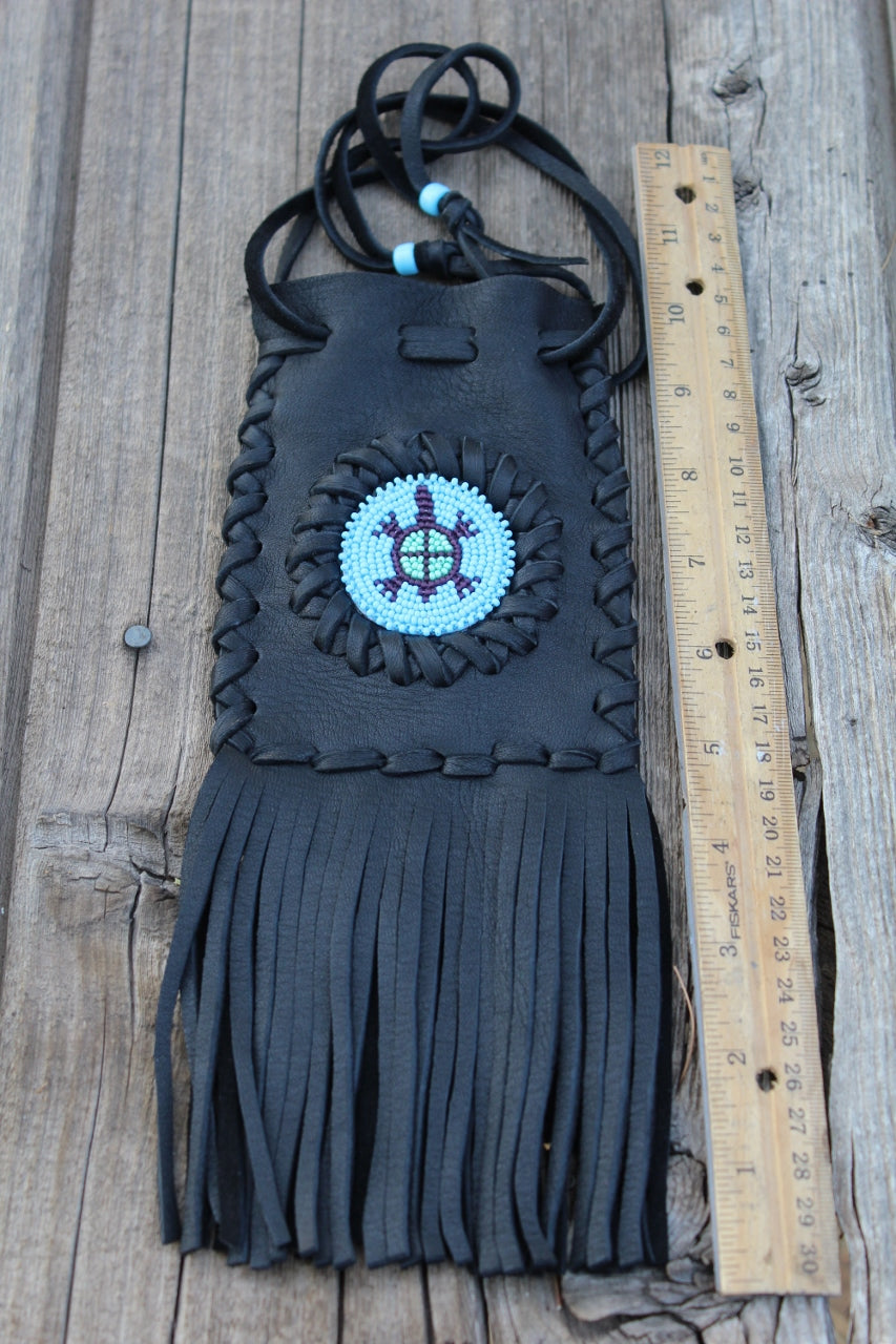 Fringed leather bag with beaded turtle totem