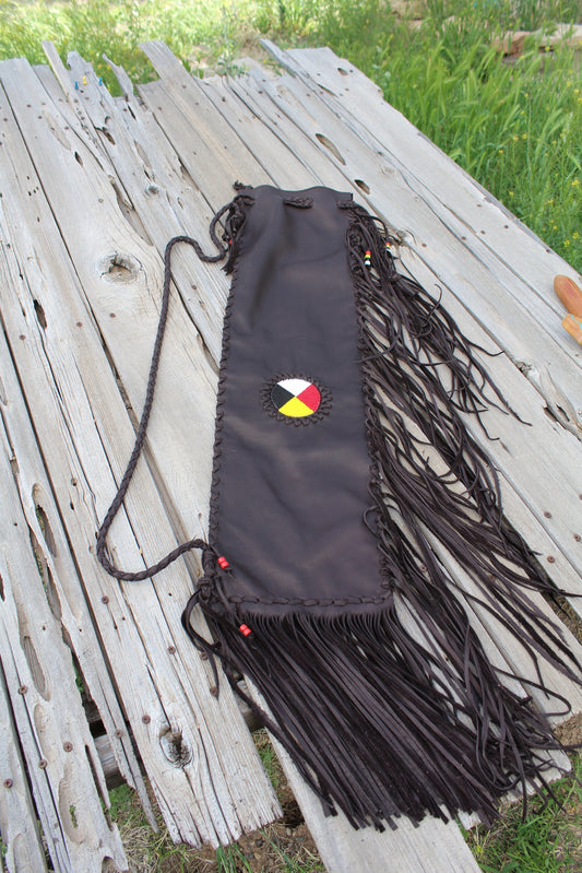 Fringed leather flute bag with beaded medicine wheel